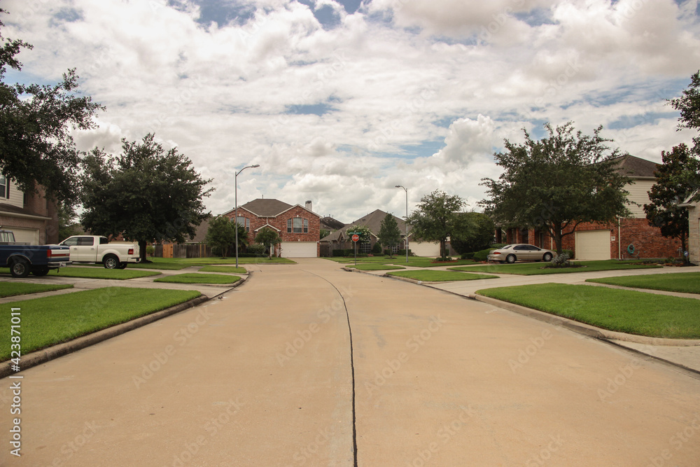 Fototapeta premium American suburbs. Random street in the neighborhood on a cloudy day.