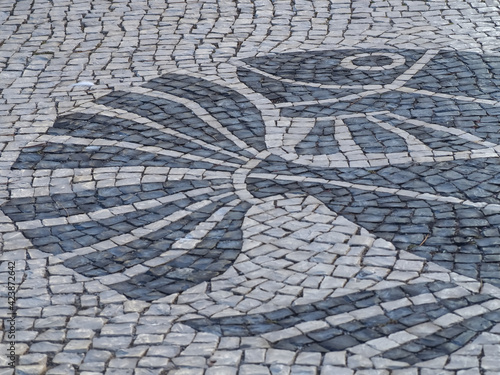 Typical art with cobblestones form a fish in Lagos Algarve Portugal