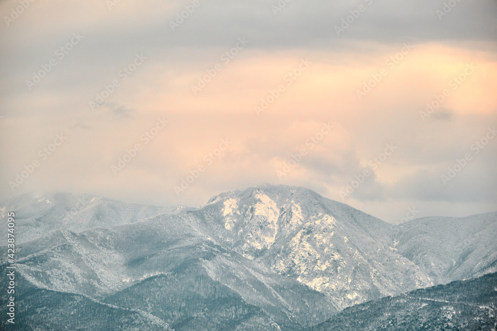 Ulu mountain (uludag) in bursa Turkey during winter and misty and foggy view of mountain from city center and many snow peak of huge moutain.