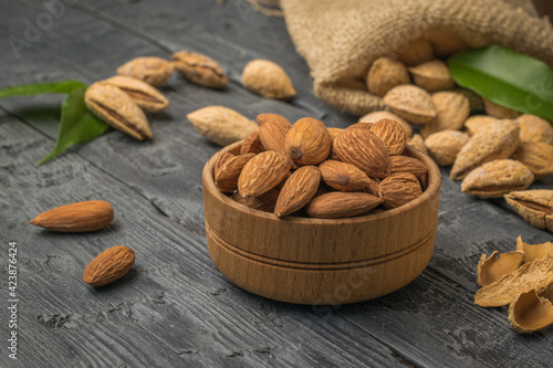 Wallpaper Mural A bowl with peeled almonds on the background of unpeeled almonds spilling out of the bag. Torontodigital.ca