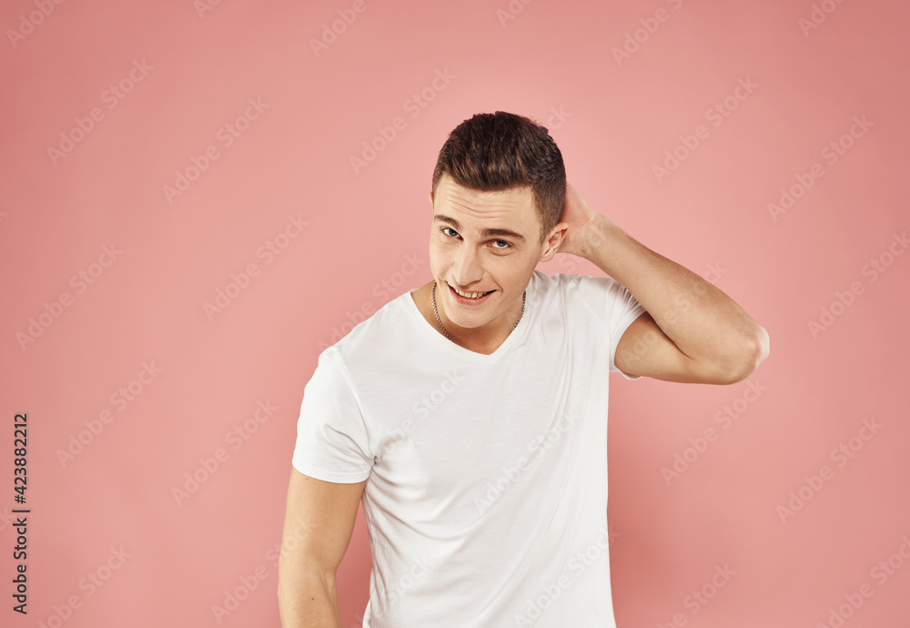 Cute man white t-shirt cropped view of pink background Cute man white t-shirt cropped view of pink background