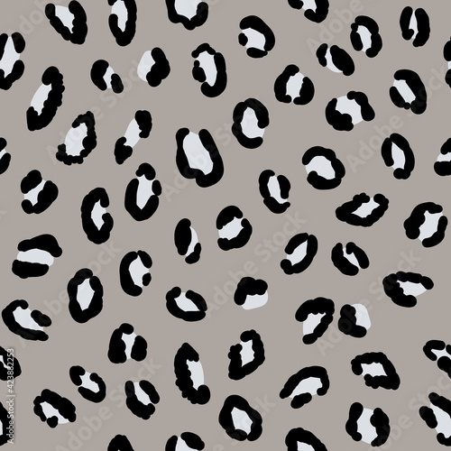 Abstract modern leopard seamless pattern. Animals trendy background. Grey and black decorative vector stock illustration for print, card, postcard, fabric, textile. Modern ornament of stylized skin © Alla