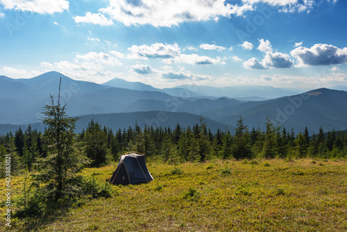 Summer vacation in the mountains with a tourist tent with beautiful views around