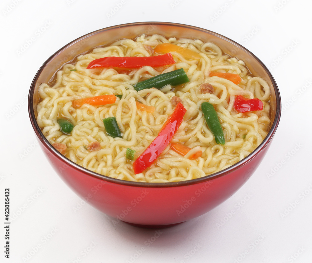 Chinese noodles with vegetables, soy sauce on a white plate
