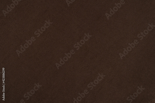 Natural fabric of brown color. Close-up long and wide texture of natural fabric. Fabric texture of natural cotton or linen textile material. © Dmytro Holbai