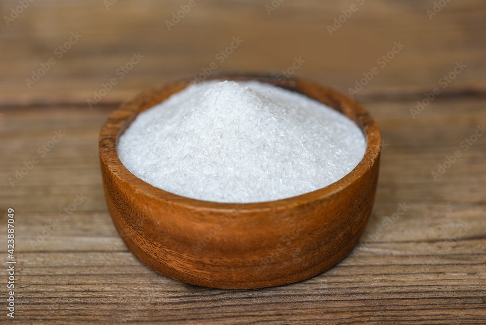 Monosodium glutamate on wooden bowl on the table background, MSG for food seasoning Monosodium glutamate on wooden bowl on the table background, MSG for food seasoning