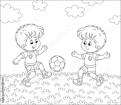 Little football players kicking a colorful ball at a match or training on a sports field, black and white outline vector cartoon illustration for a coloring book page