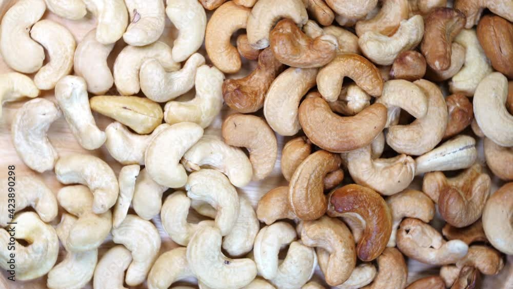 Top view Rotate Fresh cashew nut on wooden Background, 4K Top view Rotate Fresh cashew nut on wooden Background, 4K