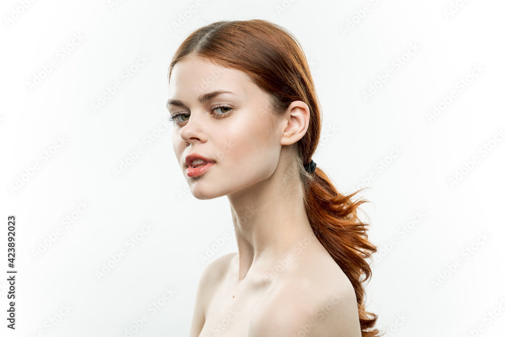 pretty woman makeup on face naked shoulders gathered hair attractive look