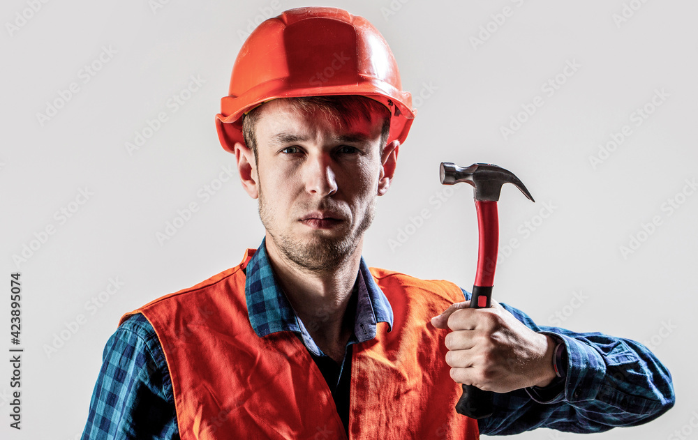 Handyman services. industry, technology, builder man, concept. Man worker, building helmet, hard hat. Hammer hammering. Builder in helmet, hammer