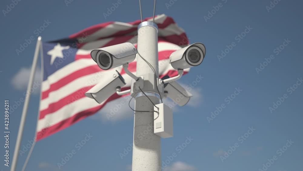 Waving flag of Liberia and the security cameras on the pole. Looping 3d animation Waving flag of Liberia and the security cameras on the pole. Looping 3d animation