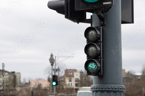 Green traffic lights for bicycles in the city. Green light for sports concept. Healthy living and sustainable transportation for healthier life, clean planet and reduction of carbon emission. 