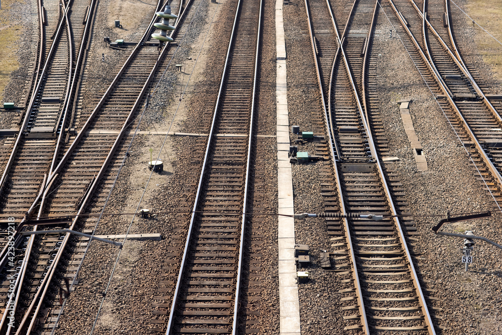 Rusty railroad tracks on gravel. Top view of railways on a sunny day Rusty railroad tracks on gravel. Top view of railways on a sunny day