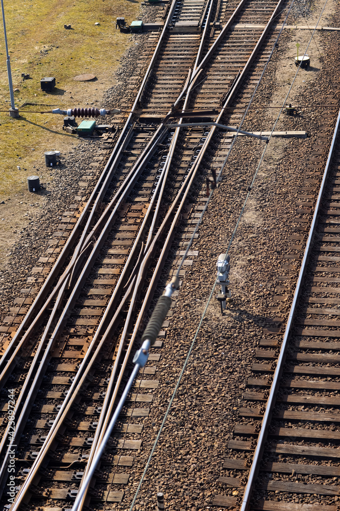 Rusty railroad tracks on gravel. Top view of railways on a sunny day