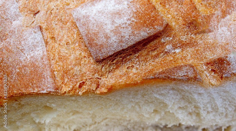 White bread bun fragment, top view. Art bread. White bread bun fragment, top view. Art bread.