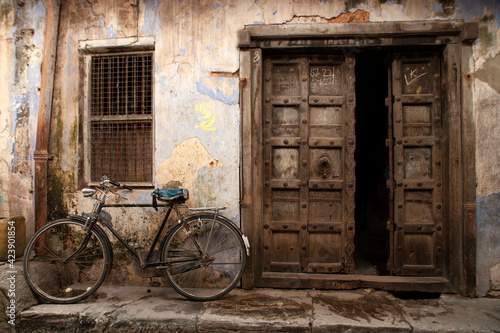 Old bicycle in front of a door opening at Zanzibar island in Tanzania in Africa