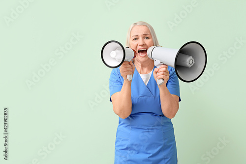 Mature female doctor with m...