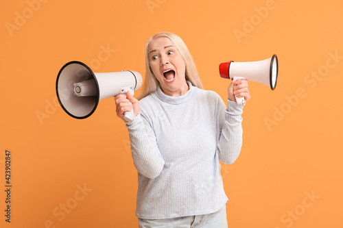 Mature woman with megaphone...