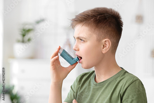 Little boy with inhaler hav...