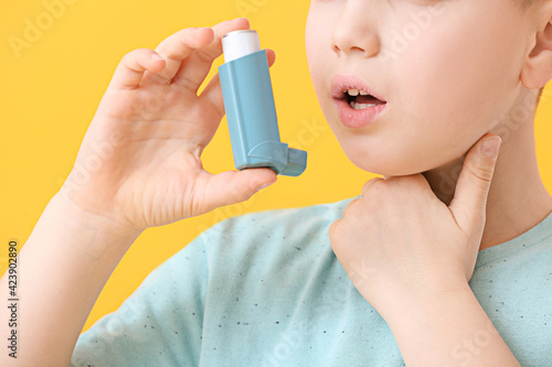 Little boy with inhaler hav...