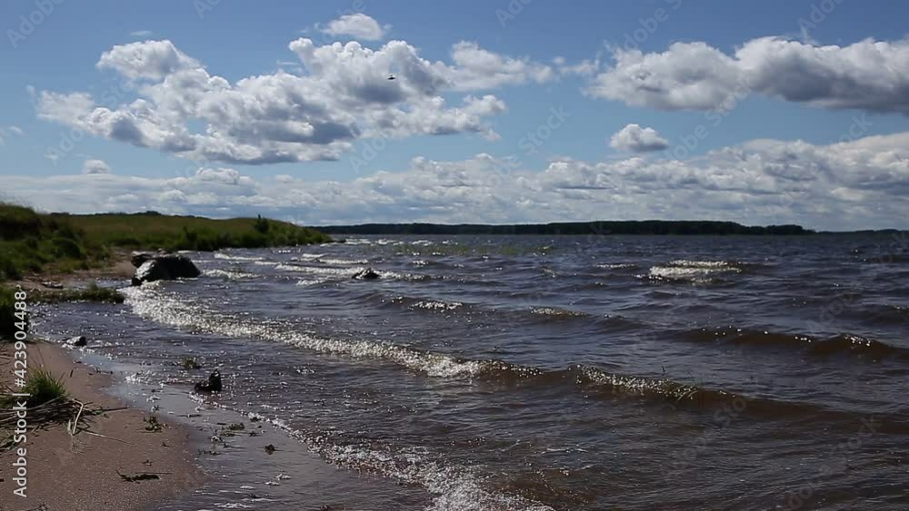 Waves of a fresh lake run up to the shore. Waves of a fresh lake run up to the shore.