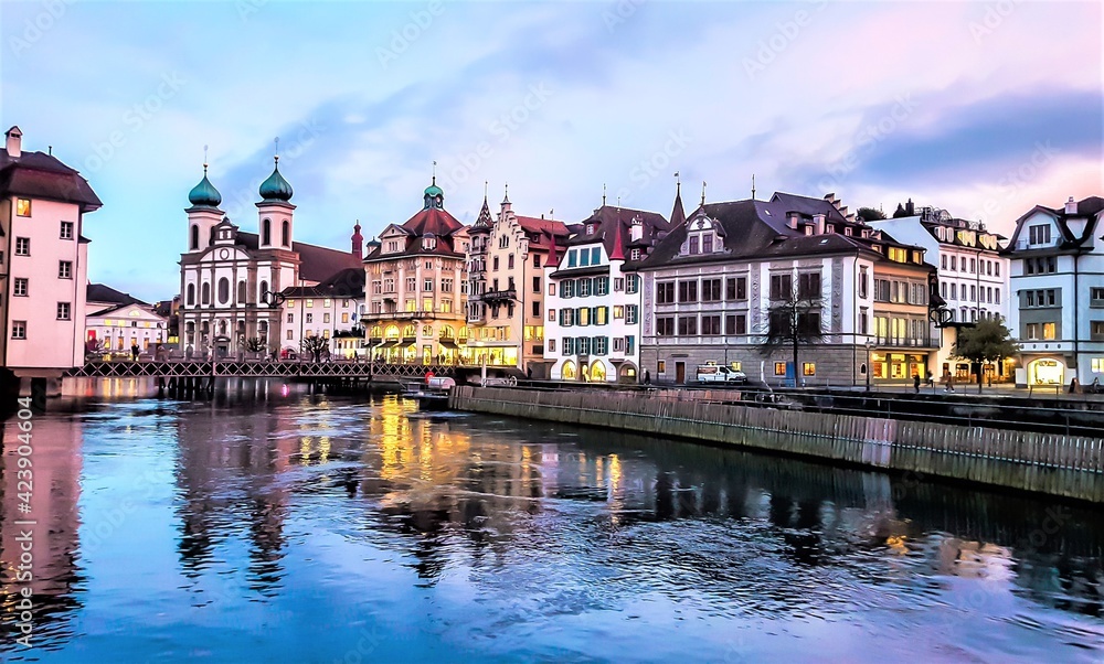 Jesuit Church along the river Reuss in Lucerne's old town. Evening view. Switzerland.