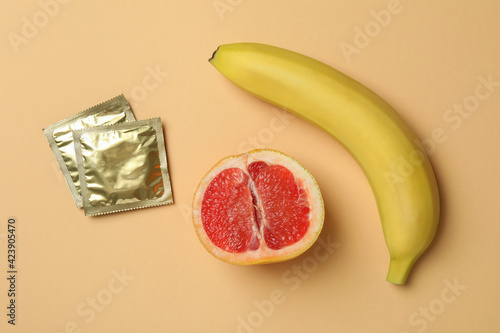 Sex concept on beige background, top view