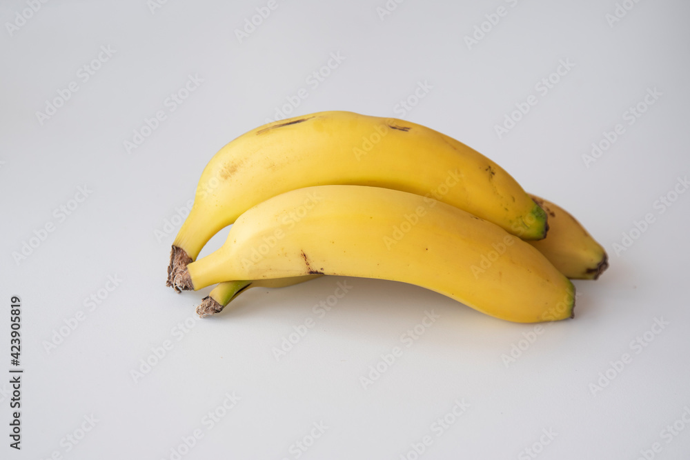 Tasty whole pieces of banana; exquisite canarian fruit ewexposed on a completely white background Tasty whole pieces of banana; exquisite canarian fruit ewexposed on a completely white background