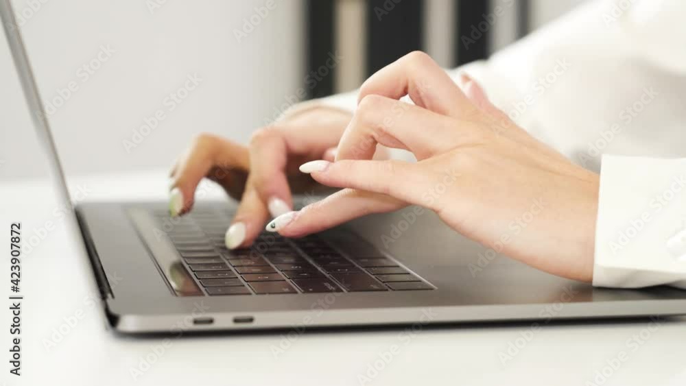 person typing on a laptop person typing on a laptop
