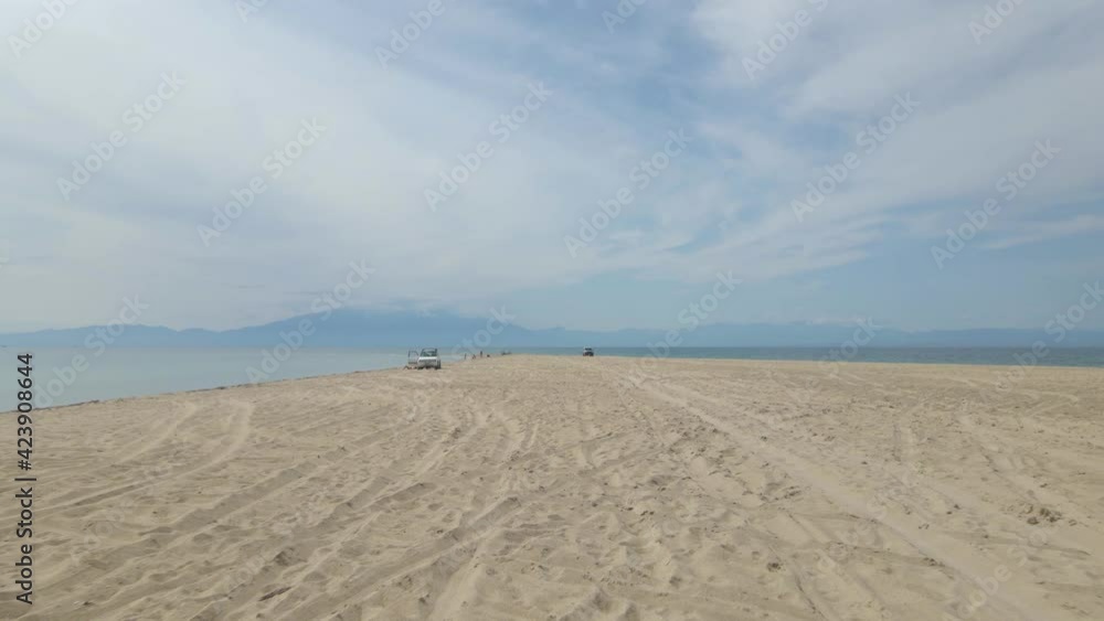 4k moving forward close to the ground clip over a peninsula on the tropical beach of Epanomi, Halkidiki, Greece 4k moving forward close to the ground clip over a peninsula on the tropical beach of Epanomi, Halkidiki, Greece