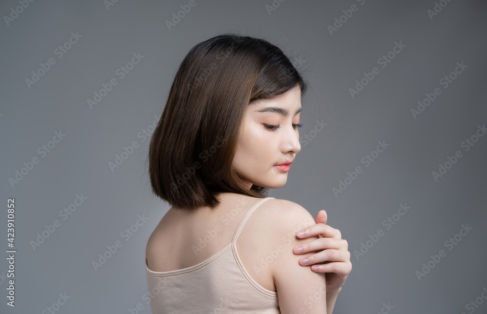 Beautiful asian woman with a beautiful face.She touched her shoulder. Beautiful asian woman with a beautiful face.She touched her shoulder.