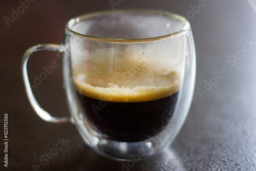 Glass cup of coffee, close up