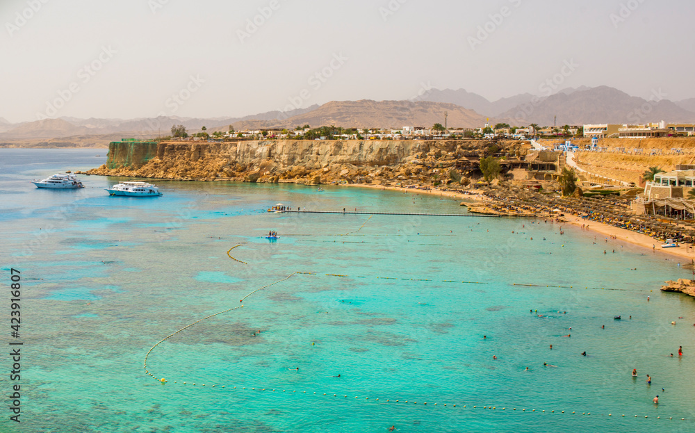 sunny panorama of ras um el sid bay in sharm el sheikh with sea, reef and beaches