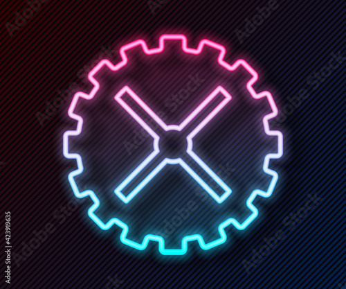 Glowing neon line Bicycle sprocket crank icon isolated on black background. Vector
