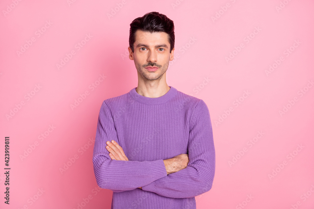 Photo of confident pretty young guy wear violet sweater arms crossed isolated pink color background Photo of confident pretty young guy wear violet sweater arms crossed isolated pink color background