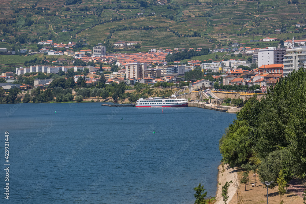 View at the Douro river on Regua, downtown city and typical landscape of the highlands in the north of Portugal