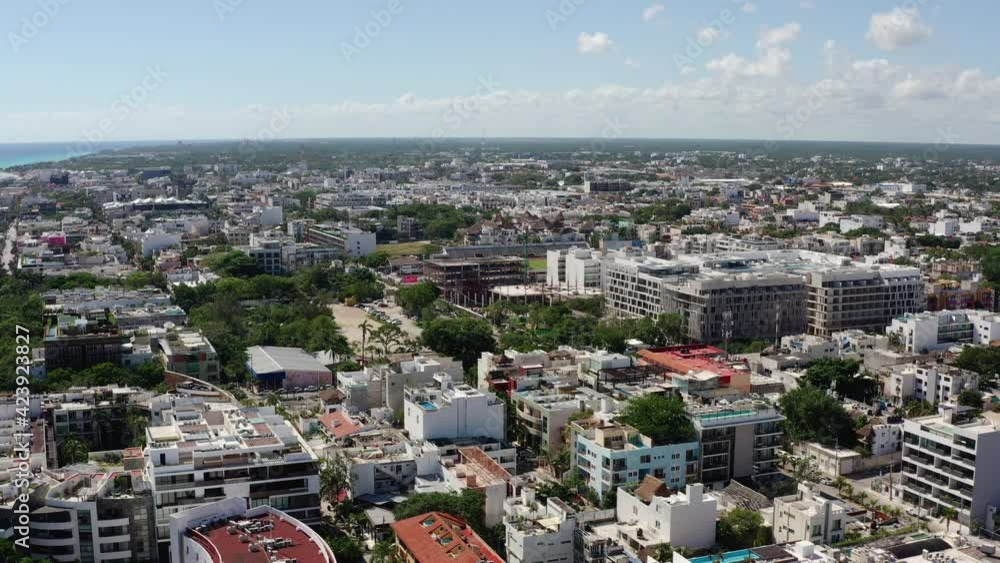 Drone video of urban cityscape in Latin America. Houses on the central streets of the city in a beautiful landscape with roads on the Caribbean sea.Aerial view of Playa del Carmen Mexico. Drone video of urban cityscape in Latin America. Houses on the central streets of the city in a beautiful landscape with roads on the Caribbean sea.Aerial view of Playa del Carmen Mexico.