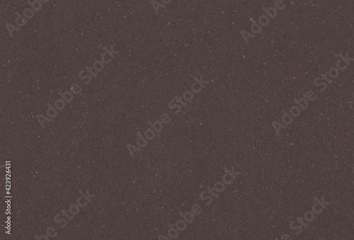 Recycled dark brown paper background with inclusions of small natural fibers. Extra large highly detailed image.