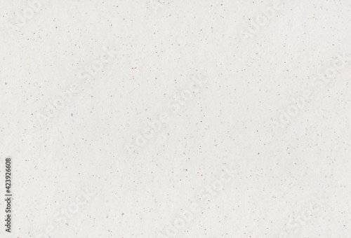 Recycled paper background with inclusions of small natural fibers. Extra large highly detailed image.
