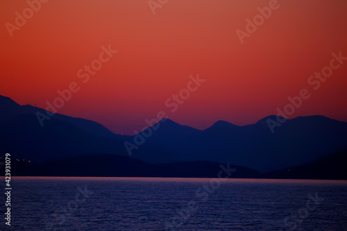 red sunset in the mountains, landscape nature silhouette of mountains at sunset, summer look