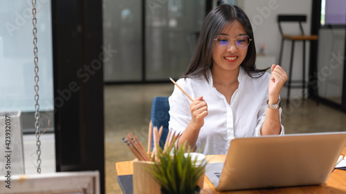 Businesswoman getting exited after hearing a good news on her project