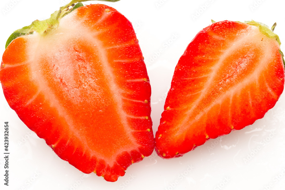 Two strawberries close up on white background Two strawberries close up on white background