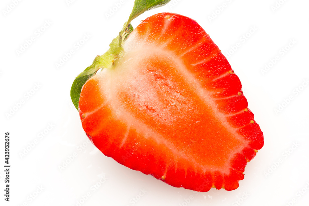 Two strawberries close up on white background