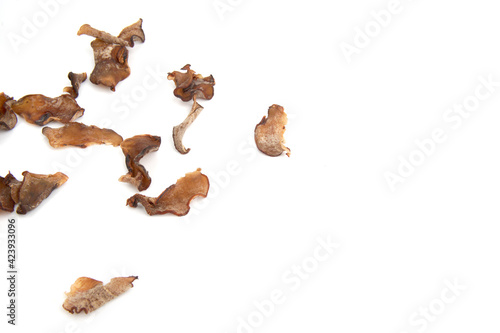 Dried tamarind slices scattered isolated on white background © Akmalism