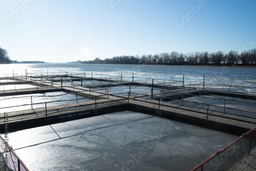 Obraz na płótnie Cages for fish farming in the natural river w salonie