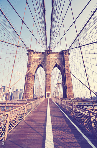 Photography Retro toned picture of Brooklyn Bridge at sunset, New York City, USA
