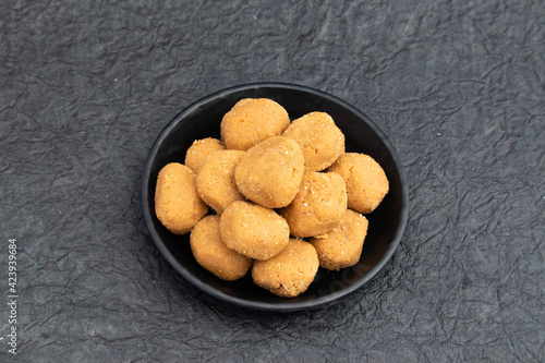 Auspicious Indian Mathura Peda Or Pede Offered As Prasad To Hindu God Is Mithai Made Of Mawa Khoya Makhan Meetha Gud Doodh Khoa Malai Mava Gur Served In Plate. Isolated On Black Background