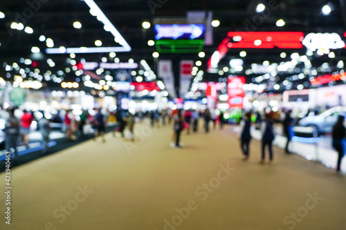blur background of international motorshow, Bangkok , Thailand. car show room. Abstract blurred image people in international cars exhibition.