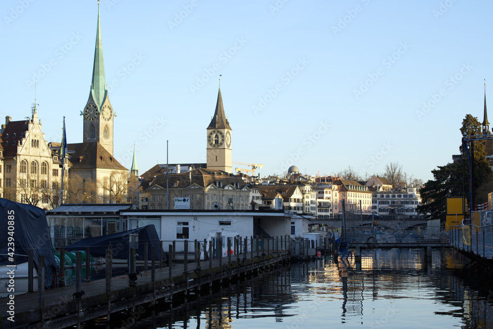 Old town of Zurich with churches Fraumünster (German), translation is Women's Minster, and St. Peter. Photo taken March 30th, 2021, Zurich, Switzerland.