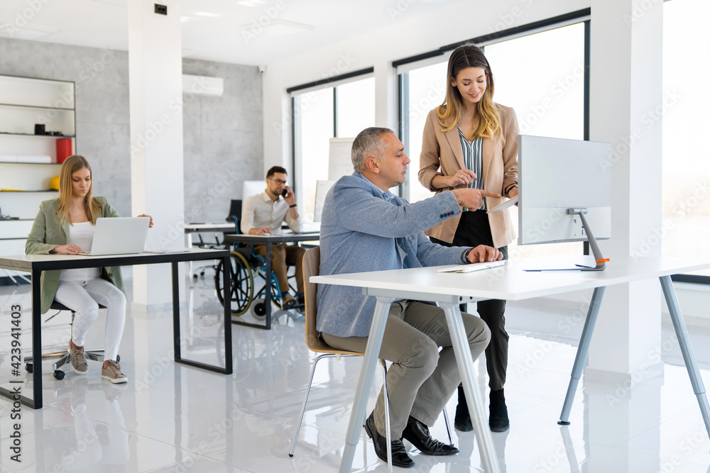 Group of business people working together in office Group of business people working together in office